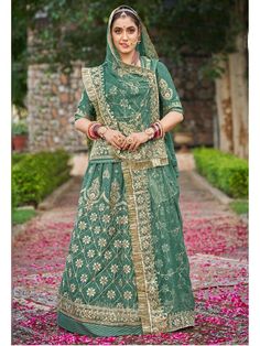 Pure Upadda Silk Mehendi Sangeet Rajputi Poshak In Green Color-81926 Product Details: Fabric: Pure Upadda silk Poshak with Contrast Humrahi Pure Odhna Work: 10 kali Multi Sequence cobinations work with resham work Hevy Odhni 4side+Jaal Desiner work with Pallu butta & gotta kiran turii Kurti with heavy baju & gala workWith work magji Color Family: Green Style:Rajasthani, Rajputana Occasion:Festive, Traditional,Wedding Washing Instruction:Dry Wash The Semi-stitched Lehenga Waist and Hips are Custo Green Lehenga With Resham Embroidery For Transitional Season, Transitional Green Lehenga With Resham Embroidery, Pista Green Sharara With Pallu For Navratri, Eid Pista Green Choli With Cutdana, Green Traditional Wear For Reception And Navratri, Green Traditional Wear For Reception During Navratri, Green Chanderi Choli For Transitional Season, Transitional Green Lehenga With Dupatta, Transitional Green Traditional Wear For Reception