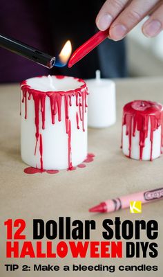 someone is decorating some candles with red and white icing on the top one