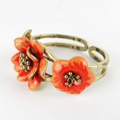 Gorgeous vintage articulated bracelet with enameled flower.       Condition:  Very good preowned condition.  Creator: -  Materials and Techniques:  metal, enamel  Marks:    Date (~):  1960s  Place of Origin:  France  Measurements: Diameter interior 5,5 cm, middle flower 3,5 cm  Weight: circa 70 gr Retro Enamel Bracelets For Gifts, Vintage Bracelet Jewelry For Spring, Retro Enamel Bracelet For Gift, Retro Enamel Bracelets For Gift, Vintage Spring Bracelet Jewelry, Vintage Spring Jewelry Bracelet, Vintage Flower Bracelets For Spring, Adjustable Metal Flower Ring, Adjustable Flower Shaped Metal Ring