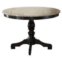 a round table with a black base and white marble top