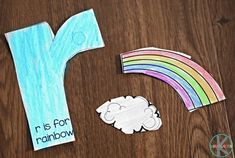 the letter k is for rainbow craft with cut out paper and colored pencils next to it