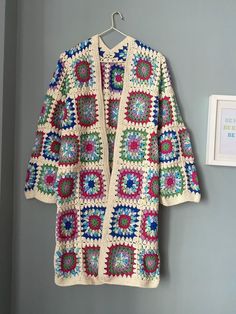 Granny Square Cardigan, Marbled Knit Coat, Retro Vintage Jacket, Clear Blue Cardigan, Pink Boho Long Cardigan, Moms for Gift, Gift for Her, XMAS, Women 🧥It is my pleasure to be offering this awesome fashion multicolor crochet jacket. This coat is perfect for four seasons, ANYWHERE, ANYTIME. The cardigan looks very nice with dress, with jeans and with any other clothing. You can use at home, at work, and outside as you wish for many years. MEASUREMENTS The measurement table is at the end of the Casual Granny Square Cardigan For Winter, Winter Cotton Crochet Outerwear, Winter Crochet Cotton Outerwear, Winter Cardigan With Granny Square Long Sleeves, Cozy Winter Cardigan With Granny Squares, Winter Crochet Cotton Cardigan, Winter Granny Square Long Sleeve Cardigan, Winter Long Sleeve Granny Square Cardigan, Cozy Granny Square Cardigan For Winter