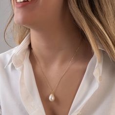 This bold pearl necklace is made of real freshwater pearl and 18k solid real gold. You can buy only pendant or pendant with chain. Please choose from options list.  There is a single real pearl pendant on the necklace. Pearl shape is teardrop. Chain style is cable chain and 1 mm (0.03 inch) thickness. Lenght of chain: 50 cm (19,6 inch) Dimensions of pearl: H: 22 mm (0,86 inch) W: 10 mm (0,39 inch) Our pearls has got smooth surface. Shape and dimensions can be slightly different because it's natu Teardrop Akoya Pearl Necklace With Pendant, Akoya Pearl Teardrop Pendant Necklace, Pear-shaped Pearl Drop Necklaces, Akoya Pearl Teardrop Necklaces With Pearl Chain, Teardrop Akoya Pearl Chain Necklaces, Teardrop Akoya Pearl Necklaces With Pearl Chain, Drop Pearl Pendant Necklace, Classic Pear-shaped Pearl Pendant Jewelry, Classic Teardrop Baroque Pearl Necklace