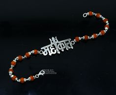 This amazing silver Rakhi crafted from 925 silver with immense precision. It exudes excellent craftsmanship and will surely look wonderful on your brother's wrist. handmade custom Mahakal Bracelet Or Rakhi bracelet this is special design beaded bracelet we can use either Rakhi bracelet or daily use bracelet for unisex. Best Rakshabandhan wishes sibling gift for your brother and sister's. Metal-925 sterling silver. Item type-Rakhi Bracelet. Length-6 inches.to 9 inches (select you size from option Sterling Silver Temple Jewelry Bracelet, Adjustable Silver Jewelry For Puja, Adjustable Silver Bracelets For Diwali, Adjustable Sterling Silver Bracelets For Diwali, Silver Temple Jewelry Bracelets For Ceremonial Occasions, Ceremonial Silver Temple Jewelry Bracelet, Silver Bracelet For Puja And Festivals, Traditional Silver Bracelets For Diwali, Traditional Silver Sterling Silver Bracelets