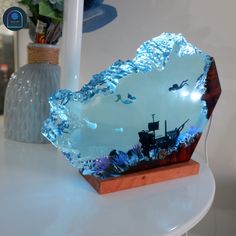 a glass bowl sitting on top of a table