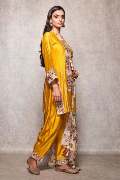 Mustard kurta with all-over floral embroidery and round neck. Comes with salwar and embroidered dupatta.
Component: 3
Embroidered
Neckline: Round
Sleeve Length: Full
Fabric: Cotton, Kota Doria
Color: Yellow
Embroidery at the sleeves and hem of the salwar
Straight fit kurta
Tie-up at the neck with tassels
Scallop hem dupatta
Tassels on the dupatta - Aza Fashions Dupatta Tassels, Yellow Embroidery, Kurta Set For Women, Embroidered Dupatta, Scallop Hem, Embroidered Neckline, Fashion App, Kurta Set, Scalloped Hem