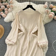 DETAILS: Please refer size chart before choosing. Embroidery details on sleeves and neck A-line silhouette Mid-calf length Light weight cotton blend fabric Product code: 123722 SIZE CHART: Size: S-M Bust: 37.5" Waist: 25"-37" Sleeve:22" " Length: 44.5" Beige Long Dress For Spring, Long Beige Dress For Spring, Long Beige Spring Dress, Beige A-line Long Sleeve Dress For Spring, Embroidered Beige Midi Dress, Spring Cotton V-neck Embroidered Dress, Cream Long Sleeve Midi Dress For Summer, Long Sleeve Cream Summer Dress, Cotton Dress With Embroidered Hem For Fall