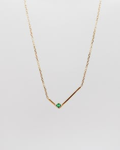 This minimalist solid gold necklace features a simple geometric L shape gold bar with a single square shape emerald, for an asymmetrical look that's both simple and strikingly graphic. The piece looks equally good worn alone or stacked with other styles.details: 18k yellow gold the square shape emerald is measured 2mm x 2mm the L shape is measured 8mm x 16.5mm 18” length with 2” extender spring-ring closure One piece in 18k yellow gold in stock, ready to ship! Modern Mangalsutra, Pendant Necklace Simple, Square Necklace, Solid Gold Necklace, Gold Bar Necklace, Jewelry Accessories Ideas, Necklace Collection, Coral Jewelry, Emerald Necklace