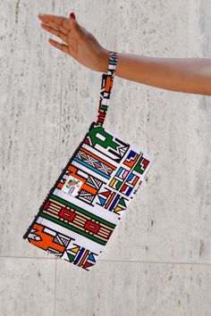 Colorful Ghanian wax print clutch wristlet to leave you hands-free while out-and-about. Holds all the essentials and more. Order it to match your backpack and duffel bag or as a stand-alone accessory. This is your new purse! Size 11” w x 7” h with 8” wrist strap Multicolor Foldable Rectangular Bag, Casual Multicolor Rectangular Clutch, Rectangular Wristlet With Adjustable Strap For Daily Use, Daily Use Rectangular Wristlet With Adjustable Strap, Adjustable Clutch For Travel, Multicolor Foldable Everyday Bags, Everyday Multicolor Foldable Bags, Multicolor Pouch Clutch With Adjustable Strap, Casual Multicolor Wristlet For Travel