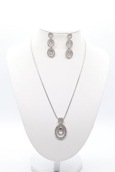 This beautiful silver necklace and earrings set is made with a multi-tiered CZ cluster pendant. The pendant is made with a high-quality cubic zirconia stone that sparkles like a diamond. Oval Jewelry With 17 Jewels For Evening, Fine Jewelry Hand Set For Evening, Elegant Oval Evening Jewelry, Elegant Oval Jewelry For Evening, Fine Jewelry Sets Hand Set For Evening, Fine Jewelry With Detachable Oval Pendant, Fine Jewelry Oval Evening Jewelry, Elegant Evening Jewelry With Detachable Pendant, Elegant Sterling Silver Jewelry Sets With Jewels