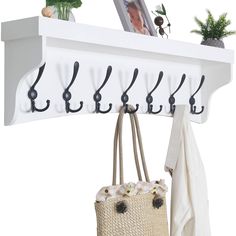 PRICES MAY VARY. wood 【Fit Studs Spacing】Hole to hole spacing:16 inch,mounting hole spacing match stud spacing.Overall size:35’’(L) * 9’’(W) * 5.5’’(H).Long wall coat rack with shelf white. 【Solid Wood】:Made of solid wood.Heavy duty wall shelf with hooks for longer daily use. 【Large White Shelf】:Shelf size:35’’(L) * 5.5’’(W),provice enough storage space.Ideal to put plants,photos or wood decor on the upper flat shelf. 【Preassembled】:The metal hooks had been mounted on the wooden plank,the 35 inc Coat Rack Wall Mount, Black Wall Shelves, Coat Rack With Shelf, Wall Shelf With Hooks, White Wall Shelves, Coat And Hat Rack, Coat Hooks Wall Mounted, Industrial Interior Style, Shelf With Hooks