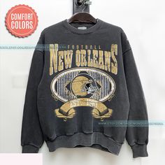 New Orleans Football Vintage Style Comfort Colors Sweatshirt,New Orleans Football Sweatshirt,Retro Saint Football shirt,Sunday Football ⭐𝐐𝐔𝐀𝐋𝐈𝐓𝐘: At Wonder Prints Era our brand believes in using the best materials to create our designs. Unlike many other shops using Gildan shirts that wear out quickly. We use luxury fabric and ink to make our products. Our designs are proudly Printed on Comfort Colors® tees/sweatshirts for that insanely soft, vintage look and feel and they meant to last. Vintage Letter Print Sweatshirt For Game Day, Retro Winter Fan Merchandise Tops, Retro Fan Merchandise Tops For Fall, Retro Fall Tops For Fan Merchandise, Vintage Fan Merchandise Graphic Sweatshirt, Vintage Graphic Print Sweatshirt For Fan Merchandise, Vintage Relaxed Fit Sweatshirt For Game Day, Vintage Graphic Print Tops For Game Day, Vintage Long Sleeve Sweatshirt For Game Day