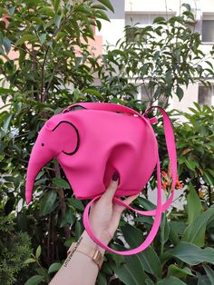 ♥Limited edition! This listing is for one PINK - ECO leather elephant bag! One of the best accessories bohemian cross-body bag is truly unique! Perfect for your personal objects, coins, decorative objects, jewelry, or other valuable items and accessories such as electronic devices (smartphones, chargers...) This clutch is very strong and durable, fashionable, classic but very stylish, perfect for your daily life, for a unique look, special occasions or events, etc. This is my favorite purse, perfect for summer days and summer nights. A zipper top. This zipper bag is highly versatile! Use it as a wallet, for makeup, or a small bag for an evening walk. 100% Handmade * Ready To Ship * This bag has been made with love and attention. Height: 21 cm ( 8 in ) Width: 30 cm ( 11 in ) Depth: 18 cm ( Pink Portable Shoulder Bag As Gift, Pink Handheld Satchel, Pink Pouch Shoulder Bag For School, Pink Mobile Phone Bag For Travel, Pink Handheld Portable Satchel, Pink Satchel Shoulder Bag For Mobile Phone, Pink Satchel With Mobile Phone Bag As Gift, Pink Shoulder Bag With Removable Pouch As Gift, Pink Satchel Shoulder Bag For Gift