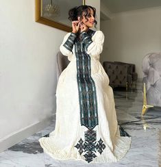 Explore the sophisticated allure of the Habesha dress, also known as the Habesha Kemis, a key element of Ethiopian traditional dress. Crafted from rich fetil fabric, these darker designs exemplify the cultural depth and elegance of Ethiopia's heritage. Material Cotton Thread Estimated delivery : 2 weeks to 3 weeks Contact WhatsApp +1(304)-306-2784Email: contact@ethiopian.store Resham Embroidered Dresses For Eid, Traditional Maxi Dress With Traditional Patterns, Traditional Long Dresses For Transitional Season, Long Traditional Dresses With Patterns, Traditional Floor-length Maxi Dress For Transitional Season, Ceremonial Dresses With Woven Motifs For Transitional Season, Traditional Ceremonies Maxi Dress With Traditional Patterns, Traditional Pattern Maxi Dress For Ceremonies, Traditional Long Maxi Dress For Ceremonies