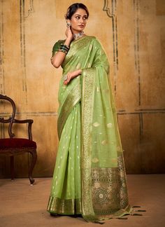 Unleash your funky side with our Pista Green Zari Weaving Tissue Silk Saree! The unique Latakan on the Pallu and beautiful contrast Mehndi Blouse make it perfect for any festive occasion. Say goodbye to boring sarees and hello to playful and quirky fashion! The unstitched blouse can be customized upto 44 inches. Do Note: All the accessories shown are for styling purpose only. Slight color variation may occur due to photographic reasons. Fall and Pico : Done Drapping Saree(Ready to wear) : On Req Drape A Saree, Bollywood Designer Sarees, Western Saree, Wedding Wear Saree, Classic Saree, Net Sarees, Wedding Sarees Online, Jacquard Saree, Designer Sari