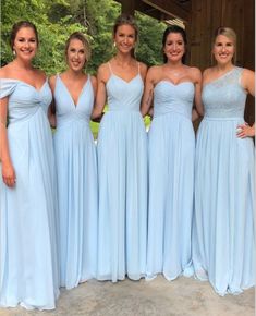 the bridesmaids are all wearing blue dresses