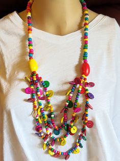 Colorful Statement Necklace Boho Ethnic Handmade Wood Beads. Stylish Necklace that will work with most outfits. This is a must have for to compliment your wardrobe. Lightweight and Easy on and Off. Makes a nice gift or just for yourself! Comes in a Gift Bag. Multicolor Fair Trade Beads For Festival, Traditional Beads For Beach Festivals, Multicolor Festival Beads, Colorful Beaded Hippie Jewelry, Traditional Multicolor Wooden Beaded Necklaces, Summer Multicolor Beaded Necklaces With Dangling Beads, Traditional Multicolor Wooden Beaded Necklace, Traditional Beaded Necklaces For Beach With Colorful Beads, Bohemian Multicolor Wooden Bead Necklaces