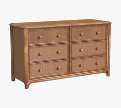 an old dresser with wicker drawers and gold knobs on the top, against a white background