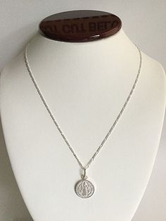 "925 STERLING SILVER SAINT BENEDICT NECKLACE 20\" LONG... FOR GOOD LUCK ,PROSPERITY AND PROTECTION. MADE IN ITALY-BEST QUALITY PENDANT : 24 mm X 15 mm CADENA DE SAN BENITO EN 925 PLATA ESTERLINA 20\" LARGO .. PARA PROSPERIDAD, BUENA SUERTE Y PROTECCION. HECHO EN ITALIA-MEJOR CALIDAD DIJE: 24 mm X 15 mm" Sterling Silver Hallmarked Pendant Charm Necklace, Sterling Silver Pendant Charm Necklace, Sterling Silver Hallmarked Pendant Charm Necklaces, Sterling Silver Necklace With Stamped 925 Round Pendant, Sterling Silver Round Pendant Necklace Stamped 925, Silver Sterling Silver Charm Necklace With Oval Pendant, Silver Oval Pendant Charm Necklace In Sterling Silver, Silver Sterling Silver Oval Pendant Charm Necklaces, Silver Oval Pendant Necklace With Sterling Silver