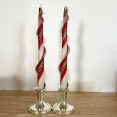 These beautifully hand made Holiday Double Flare Candy Cane Tapers will delight family and friends for years to come. Made of 100% Beeswax and sold in pairs.  Tapers:  Light the candle and let burn for about an hour. Once you extinguish let cool and trim wick.  If the wick is leaning then straighten out so it does not burn on one side.  Keep wicks trimmed short for maximum burn time.      Candle bases can be molded to fit your candleholder Please make sure the candle is secure. Please make sure Candy Cane Candle Holders, Scottish Recipes, Candle Base, Holiday Candy, In Pairs, Home Candles, Beautiful Candles, Handmade Holiday, Taper Candles