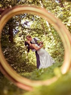 an image of a man and woman kissing in the woods on their wedding day taken from instagram