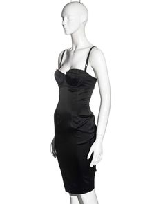 For Sale on 1stDibs - ▪ Dolce & Gabbana black evening dress ▪ Stretch satin ▪ Attached bra with adjustable shoulder straps ▪ Low back ▪ Ruched center-back seam with corset style Evening Underbust Corset Dress With Built-in Bra, Elegant Black Slip Dress With Built-in Bra, Elegant Evening Slip Dress With Built-in Bra, Sleeveless Boned Corset Dress For Formal Occasions, Sleeveless Corset Dress With Boning For Formal Occasions, Formal Sleeveless Corset Dress With Boning, Black Dress With Built-in Bra For Formal Occasions, Fitted Evening Corset Dress With Boning, Evening Satin Slip Dress With Built-in Bra