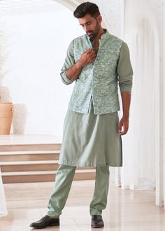 Embroidered kurta set with bundi jacket. Luxury Pista Green Nehru Jacket With Zari Work, Spring Chanderi Nehru Jacket With Resham Embroidery, Spring Resham Embroidery Chanderi Nehru Jacket, Spring Nehru Jacket With Resham Embroidery In Chanderi, Cotton Silk Bandhgala With Resham Embroidery For Spring, Festive Cotton Silk Pant Set With Chikankari Embroidery, Spring Cotton Silk Bandhgala With Resham Embroidery, Spring Chanderi Bandhgala Straight Kurta, Spring Bandhgala Chanderi Straight Kurta