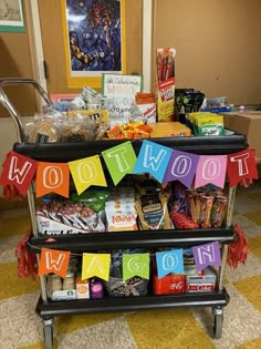 two black trolleys filled with food and candy