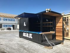 a large shipping container with the door open and water running out of it's side