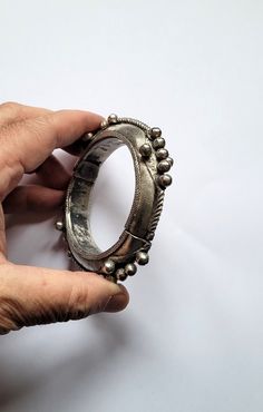 Old articulated silver bracelet - Berber from the AKKA / TATA region - Morocco Early 20th century Inner diameter: 5.9 cm Width: 1.5cm Total Weight (Gr.): 95.40 grams Feel free to contact me for any question about this item, I will be happy to answer you as soon as possible. Visit my Etsy Shop: https://www.etsy.com/fr/shop/TIFINAGH Réf : SMB039 Antique Bracelets With Oxidized Finish, Antique Bracelet With Oxidized Finish, Antique Round Bracelet With Oxidized Finish, Antique Oxidized Finish Bracelets, Traditional Silver Round Cuff Bracelet, Handmade Antique Sterling Silver Bracelet, Traditional Oxidized Bracelets For Formal Occasions, Traditional Metal Bangle For Formal Occasions, Traditional Silver Bracelets For Formal Occasions