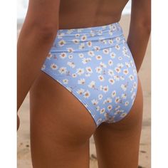 Our Favorite Kind Of Summertime Blues. High-Waisted With The Vibes To Match, This Blue Daisy Print High Maui Bikini Bottom Is Made With A Premium Blend Of Recycled Fabric Cut In A Medium-Coverage Style That Rises High Like, Above-The-Belly-Button High. It's Ideal Of Surf But Also Looks Stunning Laid Back On The Sand. It's Ultra Soft And Super Stretchy, But The Real Show Stopper Here Is That Dreamy Floral And Sky Blue Print. Now All We Need Is Some Sunshine And Saltwater. Women's High-Waisted Bik Blue Beach Bottoms For Beach Season, Blue Beach Bottoms, Blue Bottoms For Beach Season Vacation, High Rise Bottoms For Beach Season Sunbathing, Fitted High Rise Beach Bottoms, High Rise Fitted Bottoms For Beach, Blue Beachy Bottoms For Poolside, High Waist Beachy Tankini For Beach Party, Light Blue Beachwear Bottoms For Summer