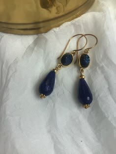 "These navy blue Drusy and lapis teardrop dangle earrings are on gold French hooks. The faceted lapis lazuli stones hang from window druzy bezel set connectors. Lapis Lazuli is considered the stone of truth and friendship.  There are accents with gold pyrite and vermeil daisy spacers. The French hook ear wires are gold vermeil. The total length is 2\". The drop length from the end of the ear wires is 1 1/2\"." Gold Teardrop Lapis Lazuli Earrings, Boho Bridal Jewelry, Tassel Necklace Boho, Yellow Jewelry, Indian Jewellery Design Earrings, Mother Of Pearl Earrings, Teardrop Dangle Earrings, Dope Jewelry, Jewelry Design Earrings