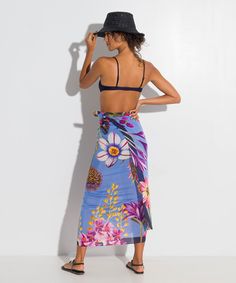 Go beyond the beach with this investment-worthy style in a stunning botanic print and elevated fabric that drapes beautifully! A sarong scarf (also known as a pareo) is a classic summer cover-up that is the epitome of versatility. Worn casual or chic, this beach-ready essential can be a dress, a skirt, or a scarf. Dimensions: 42" x 70" Materials: 80% cotton / 20% silk Made in: India ​ Bohemian Tropical Print Sarong For Pool, Bohemian Sarong With Tropical Print For Pool, Bohemian Sarong With Tropical Print For Beach Season, Bohemian Sarong For Resort Season Vacation, Bohemian Sarong For Resort Season, Summer Floral Print Sarong For Poolside, Summer Floral Print Sarong Beachwear, Beachy Floral Print Sarong For Summer, Floral Print Wrap Beachwear Cover-up