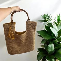 Hand Woven Natural Beach Bag: The Perfect Blend of Style and Functionality! Discover the elegance and practicality of our Hand Woven Natural Beach Bag. This handmade crochet raffia tote is perfect for the woman who values both style and function. Whether you're relaxing by the sea or strolling through the city, this versatile bag is the ideal companion for every adventure. ❁PRODUCT FEATURES: - Material: Crafted from high-quality woven wicker-textured coffee paper rope, offering both durability a Rectangular Crochet Bag With Bamboo Handle For Vacation, Jute Crochet Bag With Leather Handles, Crochet Jute Bag With Leather Handles, Crochet Jute Bag With Leather Top Handles, Jute Crochet Bag With Braided Handles, Bohemian Crochet Bag With Bamboo Handle For Travel, Straw Crochet Bag With Bamboo Handle For Travel, Vacation Jute Bag With Round Handle, Handwoven Jute Crochet Bag With Top Handle