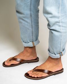 These men's leather flip flop sandals are crafted from natural Greek leather, and feature a minimalist design with flat soles for ultimate comfort during the summer season. The barefoot thong design offers a free, relaxed feel, while the leather material allows for breathability and durability. Perfect for casual wear or beach outings. All of our products are handmade with the best and highest quality leather from our beloved island of ''Crete''.  The leather used for each item may be irregular Leather Toe Post Flip Flops For Vacation, Leather Toe Post Slippers For The Beach, Leather Sole Flip Flops For Summer, Summer Leather Flip Flops With Leather Sole, Leather Slippers With Single Toe Strap For Summer, Leather Toe Loop Flip Flops For Vacation, Leather Flip Flops With Single Toe Strap For Summer, Summer Leather Flip Flops With Single Toe Strap, Leather Toe Ring Sandals With Rubber Sole For Beach