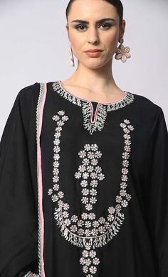 Introducing our enchanting 3-piece Salwar Kameez with Dupatta set, where traditional craftsmanship meets contemporary style. This set features stunning machine embroidery adorned with delicate sequins work, adding a touch of glamour and sophistication to your ensemble. Each piece is meticulously crafted to perfection, ensuring that every stitch and detail exudes elegance and charm. Whether you're attending a festive celebration or a formal event, this Salwar Kameez set promises to elevate your look with its timeless appeal and exquisite craftsmanship. Experience the epitome of luxury and grace with our 3-piece Salwar Kameez set, designed to make you shine on every occasion. Size & Fit Model height is 5’9’ and is wearing a Small sizeMaterial & CareMaterial: Rayon Care: Gentle machine wash i Black Palazzo Set With Zari Work For Diwali, Black Sharara With Chikankari Embroidery For Diwali, Diwali Black Palazzo Set With Zari Work, Bollywood Style Black Palazzo Set For Festive Season, Bollywood Style Black Palazzo Set For Festive Occasions, Festive Bollywood Style Black Palazzo Set, Black Zari Work Palazzo Set For Festivals, Black Palazzo Set With Zari Work For Navratri, Black Palazzo Set With Zari Work For Festivals