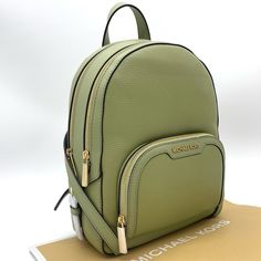 Brand New With Tag Michael Kors Medium Jaycee Backpack Color: Light Sage Backpack Pebbled Leather 100% Leather Trim: 60% Polyurethane /20% Polyester/ 20% Cotton Gold-Tone Hardware 8.75"W X 12"H X 4.25" D Exterior Details: Front Zip Pocket Interior Details: Back Zip Pocket, Tech Compartment, Front Slip Pocket Lining: 100% Polyester Zip Fastening Imported Michael Kors Backpack For On-the-go, Luxury Green Backpack For Daily Use, Michael Kors Leather Backpack With Zipper Closure, Michael Kors Leather Backpack For Errands, Casual Michael Kors Bag With Zipper Closure, Casual Michael Kors Backpack With Adjustable Strap, Michael Kors Backpack With Detachable Strap For Everyday Use, Michael Kors Backpack With Detachable Strap For Daily Use, Michael Kors Casual Backpack For Everyday Use