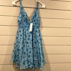 Urban Outfitters Smocked Mini Dress Nwt!! Casual Blue Smocked Beach Dress, Blue Sleeveless Smocked Summer Dress, Blue Sleeveless Summer Smocked Dress, Light Blue Vacation Dress With Smocked Back, Blue Summer Sundress With Smocked Bodice, Blue V-neck Smocked Dress, Casual Blue Smocked Dress With Ruffles, Blue Mini Smocked Dress With Ruffles, Blue Smocked Sundress For Summer