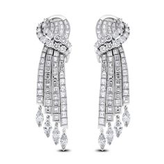 These classic channel set earrings exude luxury and extravagance. The are an ideal family heirloom or present for an important occasion. Diamond Shape: Round, Baguette & Marquise Total Diamond Weight: 14.75 ct Diamonds Color: G - H Diamonds Clarity: VVS - VS (Very Very Slightly Included - Very Slightly Included) Metal: 18K White Gold Metal Wt: 31.95 gms Setting: Prong & Channel Set Length: 2.4 Inches (6.10 cms) Omega Back Closure Diamond Waterfall Earrings, Unique Diamond Earrings, Heart Diamond Earrings, Classic Channel, Waterfall Earrings, Ideal Family, Diamond Chandelier Earrings, Pom Earrings, Diamond Chandelier