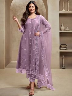 Elevate your wardrobe with our Amyra Dastur Lavender Floral Kurta. Made from a luxurious silk blend, this A-line kurta boasts exquisite floral embroidery and a scalloped hem for a sophisticated touch. Complete with trousers and a dupatta, this ensemble exudes grace and elegance. Perfect for any occasion. Lavender Salwar Suit, Anarkali Design, Indo Western Lehenga, Western Lehenga, Amyra Dastur, Anarkali Designs, Sari Lehenga, Cotton Salwar Kameez, A Line Kurta