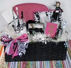 a black basket filled with items on top of a table