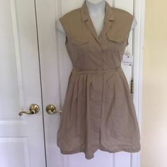 This Dress Is Has Collar Neck, Sleeveless, Modern Fit, Flap Pocket At The Front, Button Down Pleated Skirt Dress, Unlined With Belt. Color Dark Dune Spring Sleeveless Mini Dress With Button Closure, Sleeveless Mini Dress With Button Closure For Spring, Spring Casual Sleeveless Collared Dress, Fitted Sleeveless Dress With Buttons For Day Out, Fitted Sleeveless Button-up Dress, Knee-length Sleeveless Dress With Button Closure For Daywear, Sleeveless V-neck Dress With Button Closure For Spring, Fitted Casual Sleeveless Button-up Dress, Fitted Button-up Sleeveless Casual Dress