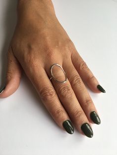 "Hammered finish oval ring made 1 inch long by 1/2 inch wide. Statement piece made with sterling silver metal. I make ring sizes 7, 7 1/2, 8 and 8 1/2. M A T E R I A L Sterling Silver S I Z E S We offer US Ring sizes 7-8.5 S T Y L E Hammered or Smooth D E T A I L S Our rings will not turn your finger green they are made of quality material, so you can rest assured that you can wear your jewelry everyday, at any time! (In a pool, in the shower, and washing dishes!) S H I P P I N G These packages Modern Oval Link Rings For Everyday, Modern Everyday Rings With Oval Link, Silver Oval Rings For Everyday Wear, Everyday Oval Sterling Silver Rings, Modern Silver Oval Link Ring, Handmade Modern Oval Rings, Modern Handmade Oval Rings, Minimalist Nickel-free Oval Rings, Nickel Free Oval Rings For Everyday