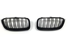 two front bumper grilles for the bmw e - class coupe, one is black