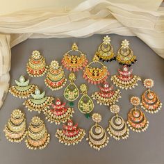 A pair of golden-toned Hand Painted Traditional Meenakari Earring for Saree.  Size & Other Details Material : Brass, Pearl, Meena work Shape : Flower Shaped Attire : Lehenga Choli, Salwar Suit, Kurti, Saree, Flared Dress FYI: Assorted designs will come depending on the stock available. 5 color left Shop more: https://www.etsy.com/shop/FashionCrabIndia/ Style Tip ---------------------------- Elevate your traditional outfits with our unique collection. Perfect for festivals. Care Tips ------------ Kundan Hoop Earrings For Diwali Celebration, Temple Style Kundan Hoop Earrings For Celebration, Celebration Kundan Hoop Earrings In Temple Jewelry Style, Chandbali Earrings Gift For Navratri, Kundan Chandbalis For Navratri, Heavy Multicolor Chandbalis For Eid, Meenakari Hoop Earrings For Celebrations In Temple Jewelry Style, Chandbali Earrings For Navratri Gift, Meenakari Hoop Earrings For Celebration