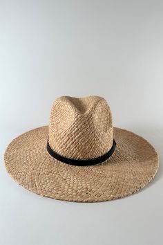 Straw panama hat with a black leather band. Made of natural straw, The Everywhere Hat has a wide brim that protects you from the sun while looking casual and modern. The leather band completes the hat with a timeless look that pairs well with most outfits for a stylish sunny look. Natural Braided Fedora Straw Hat, Braided Natural Straw Fedora Hat, Natural Braided Straw Fedora Hat, Natural Braided Straw Fedora, Chic Natural Hat Bands For Vacation, Chic Natural Color Hat Bands For Vacation, Everyday Straw Fedora In Natural Color, Casual Natural Wide Brim Straw Hat, Natural Braided Brimmed Fedora