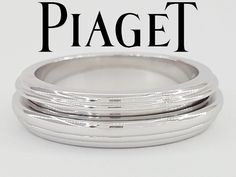 three silver rings sitting on top of each other with the word piagett written below them