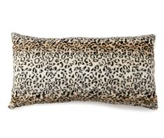 a leopard print pillow on a white background