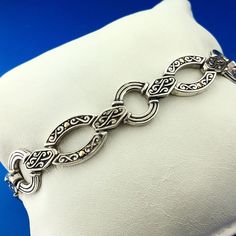 * Designer 18K White Gold Sterling Silver Scroll Oval Circle Link Toggle Bracelet * Length: 8-1/4" * Width: 1/2" * Clasp: Toggle * Weight: 22.3 g * Marked: 925 * 18K * Condition: Great, as pictured. * S1683    Exported By ExportYourStore :) Luxury Engraved Oval Link Jewelry, Elegant Gold Chain Bracelet With Sterling Silver Clasp, Elegant Oval Link Chain Bracelet With Toggle Clasp, Elegant Jewelry With Toggle Clasp And Oval Link, Elegant Hallmarked Chain Bracelet With Oval Links, Elegant Metal Chain Bracelet With Hallmark, Classic Oval Chain Bracelet For Anniversary, Elegant Oval Sterling Silver Bracelet, Classic Engraved Sterling Silver Bracelet