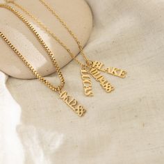 Uplift your jewelry collection with our elegant Vertical Personalized Name Necklace. Perfect for the fashion-savvy, its customized engraving and 18k Gold composition fuse timeless charm with lasting quality. Materials & Finish: * High-Quality Stainless Steel * 18k Gold, Silver Our Products are different from regular gold plating because it is a THICK layer of 18k solid gold on stainless steel, making it more durable. It offers the appearance and quality of gold jewelry at a more affordable cost. Gift Name Necklace With Pendant On Box Chain, Initial Pendant Charm Necklace Gift With Box Chain, Initial Pendant Jewelry Box Chain As Gift, Gift Initial Pendant Charm Necklace With Box Chain, Engraved Nameplate Charm Necklace For Her, Gold Plated Box Chain Charm Necklace As Gift, Gold Plated Box Chain Charm Necklace For Gift, Engraved Nameplate Charm Necklace Gift For Her, Gold Engraved Name Necklace As Gift For Her